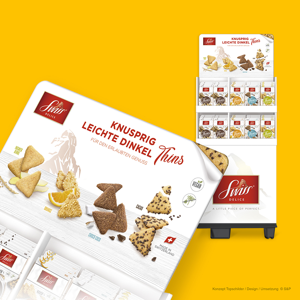 Pos-Material: Keyvisuals und Designs für Topschiler SwissDelice Biskuits-Sorten Export. Mockup Display gefüllt.